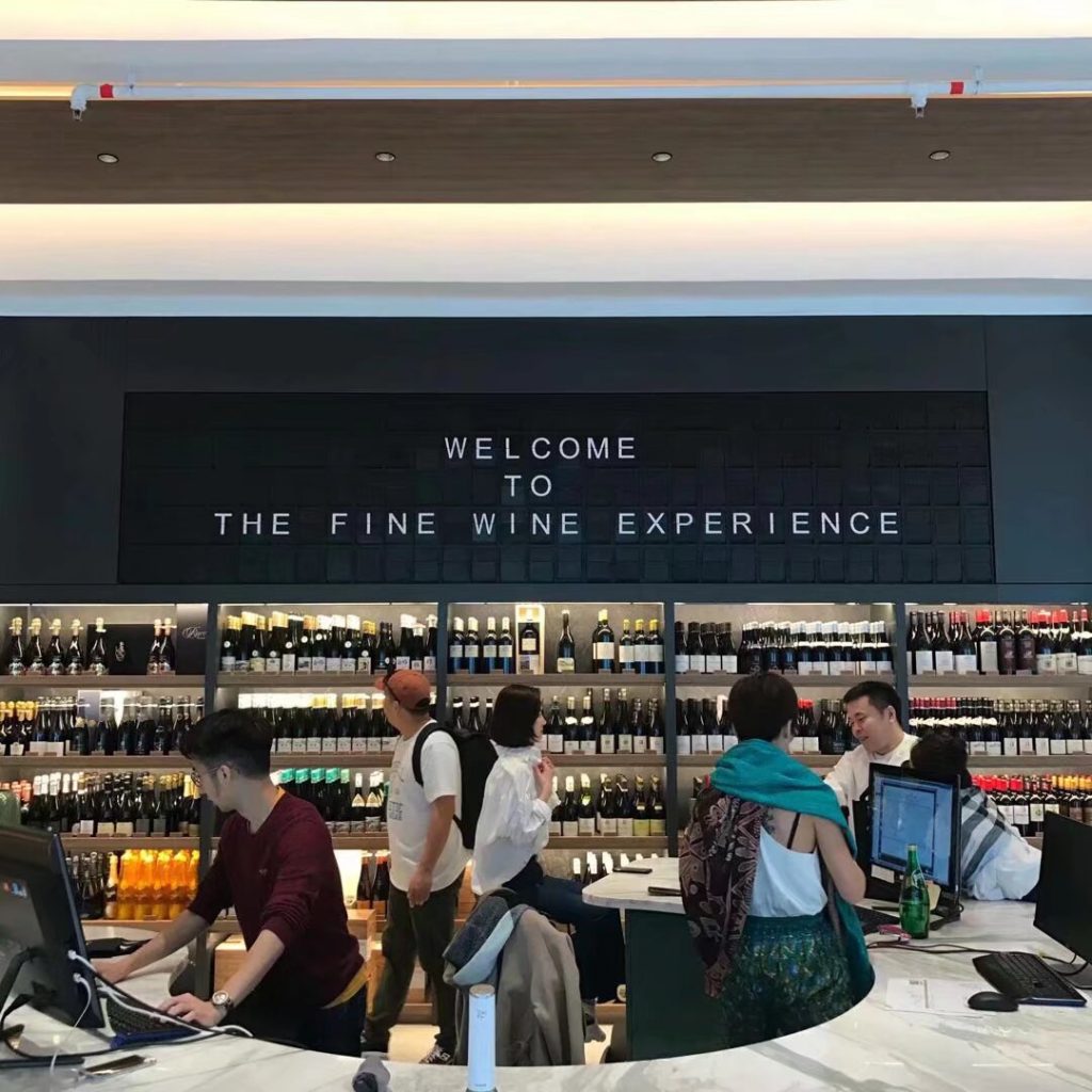 Split Flap Display showing welcome message inside a Hong Kong wine shop