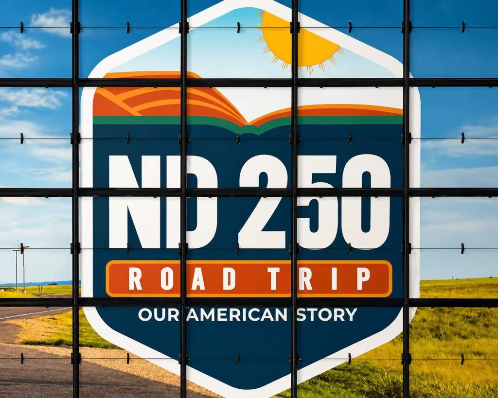 Custom picture flap display showing the ND 250 Road Trip graphic for a museum exhibition about American road trip history.