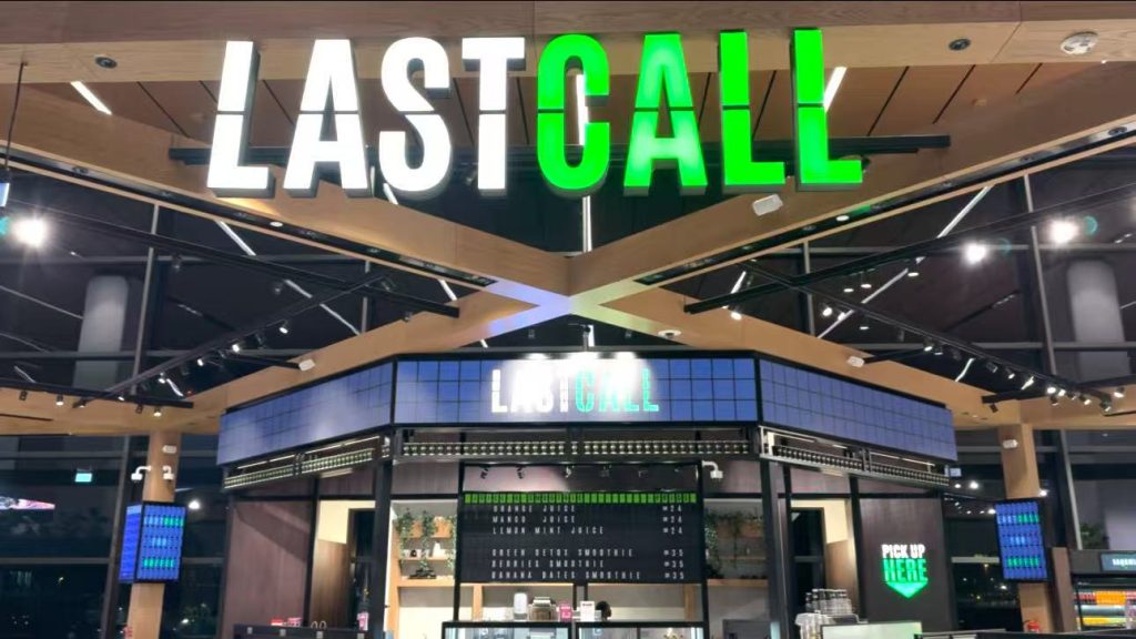 LASTCALL airport restaurant at Hamad International Airport featuring a custom split flap menu board and picture flap displays by TS Display
