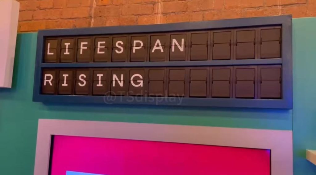 Split flap display showing LIFESPAN RISING message at The Longevity Show exhibition in London