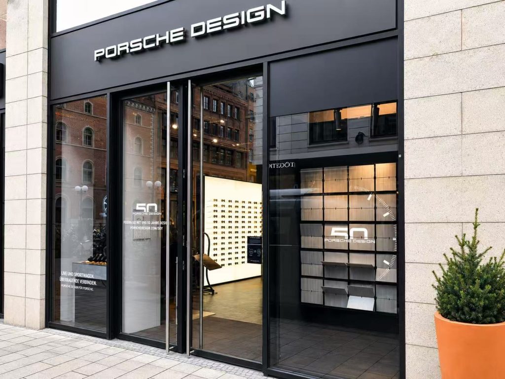 Porsche Design 50th anniversary Picture Flap Display installed in a retail storefront in Germany
