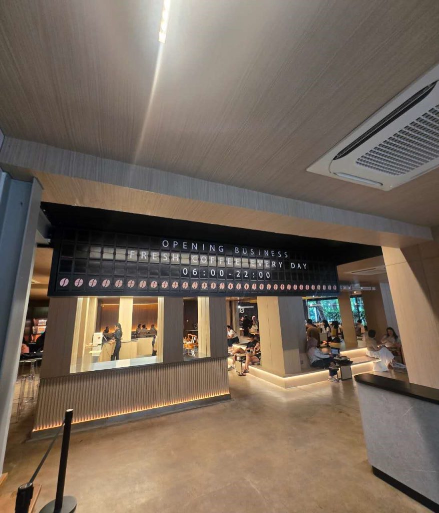 128-module split flap display operating inside a café in Indonesia