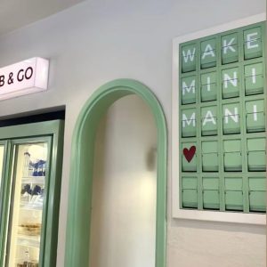 Custom Green Split Flap Display in Coffee Shop Interior
