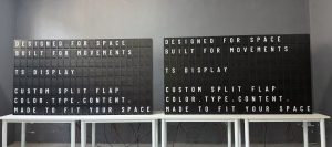 Two custom split flap displays by TS Display showing customizable typography, color and content during workshop testing.