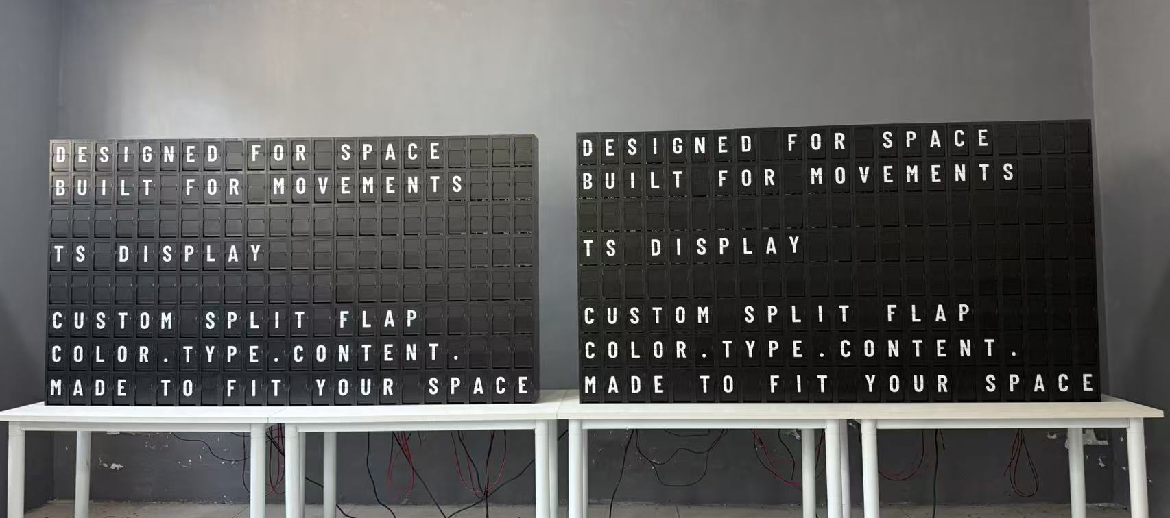 Two custom split flap displays by TS Display showing customizable typography, color and content during workshop testing.